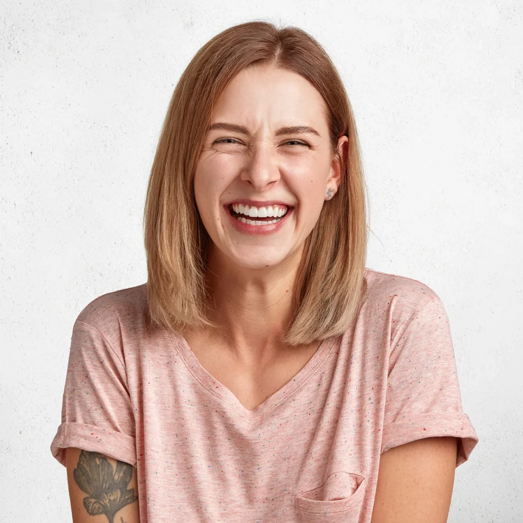 glad-pleasant-looking-woman-with-sincere-broad-smile-laughs-happily-camera-listens-anecdotes-isolated-white